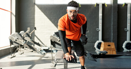Man, portrait or fitness with dumbbells at gym for weightlifting workout, exercise or training....