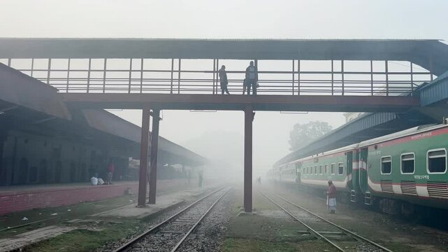 Winter Morning at Railway Station: Train arival, passenger boarding, foot over bridge, platform.