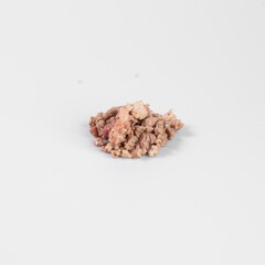 Close-up of loose, raw, ground meat on a light background. Perfect for food industry, culinary, or grocery store stock images.