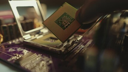 Engineer repairman holding hands in black gloves chip processor, CPU to insert into the socket of the computer motherboard. The concept of technology hardware and repair in the neon light