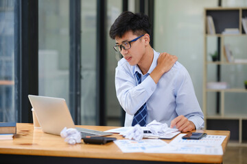 Exhausted Businessman Suffering Neck Pain from Work Stress