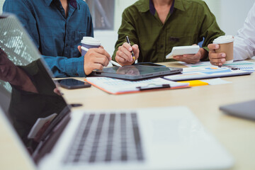 Close-up of a businessman in a meeting at the office discussing topics related to digital marketing...