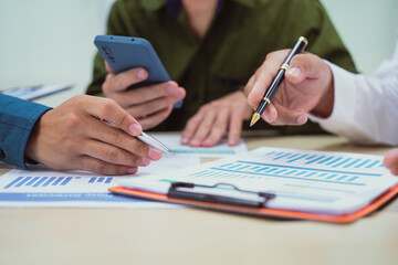 Close-up of a businessman in a meeting at the office discussing topics related to digital marketing management, financial analysis, business writing, teaching, and venture capital investments.