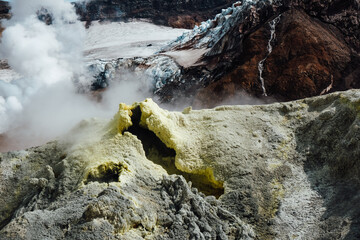 View of mountains and volcanoes from the edge of the crater