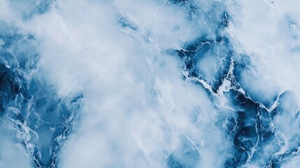 Obraz premium Blue and white marble texture with subtle gray streaks, creating a soothing and modern look. No people. No logo.