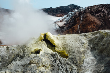 View of mountains and volcanoes from the edge of the crater