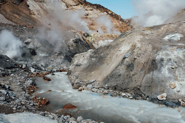 View of mountains and volcanoes from the edge of the crater