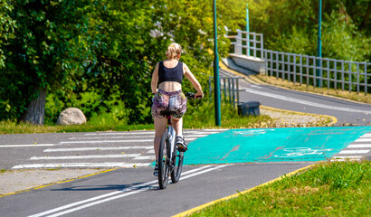 Cyclist ride on the bike path in the city Park
