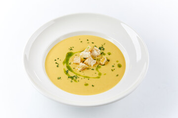 pumpkin cream soup on the white