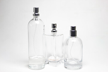 several glass perfume bottles isolated on a white background