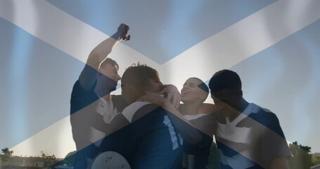 Animation of flag of scotland over diverse male rugby players celebrating - Powered by Adobe