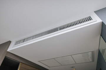 Hotel air conditioner ceiling grill, interior closeup air flow pipe hole for airflow ventilation...