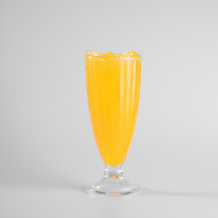 Refreshing glass of orange juice filled with ice, isolated on a white background. Perfect for health and beverage concepts.