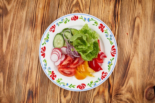 fresh vetetables on the plate, top view