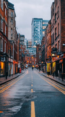 A city street with a yellow line down the middle. The street is wet and the buildings are tall