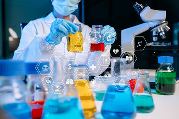 Scientist mixing chemical liquids in the chemistry lab. Researcher working