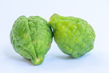 Obraz premium Tropical Kaffir Lime on White Background – Exotic Citrus with Distinctive Texture