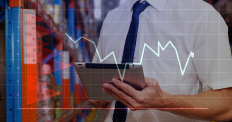 Image of financial data processing and caucasian male worker using tablet in warehouse