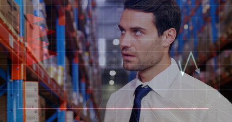 Image of financial data processing and caucasian male worker using tablet in warehouse