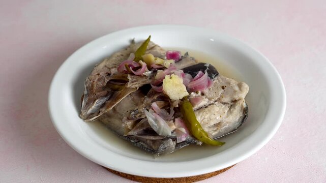 bangus paksiw is a Filipino dish that uses milkfish in vinegar and spices