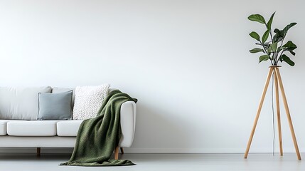 Fototapeta premium White background featuring a Scandinavian living room with light gray sofa, wooden floor lamp, and green blanket