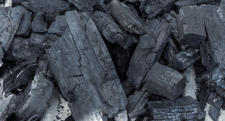 surface of charcoal texture background. a porous black solid, consisting of an amorphous form of carbon, obtained as a residue when wood, bone, or other organic matter is heated in the absence of air.