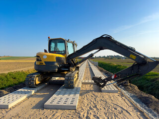 Process of making a new road with concrete slabs as a surface.