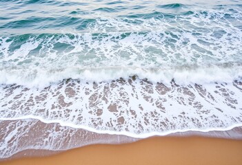 Coastal landscape with waves breaking against a sandy beach