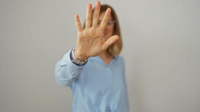 Young blonde woman wearing glasses standing and happily pointing up with five fingers over an isolated white background, showing confidence and smiling brightly
