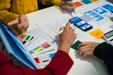 ui designer brainstorming about mobile app interface wireframe design with customer breif and color...