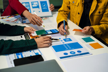 ui designer brainstorming about mobile app interface wireframe design with customer breif and color...