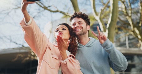 Fototapeta premium Happy couple, love and peace sign with selfie for memory, picture or photography at outdoor campus. Young man, woman or students with smile for moment, capture or friendship together at university