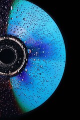 abstract holographic cd with water droplets