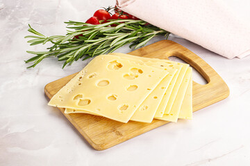 Sliced maasdam cheese with holes