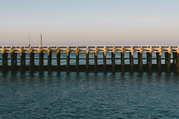 Old wooden pier on the sea shore