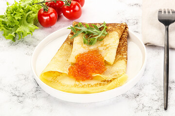 Russian pancake with red caviar