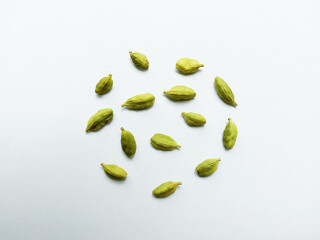 Green Cardamom in a circle shape isolated on white background - Green Ilaichi on white backgroun