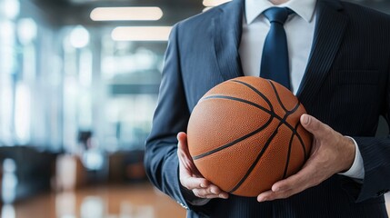 Fototapeta premium Businessman Holding Basketball.