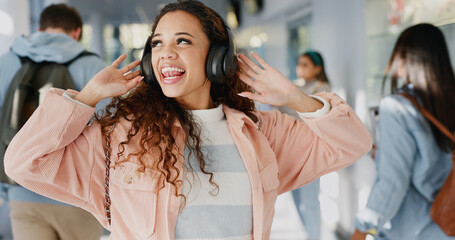 Student, music or excited in university for dance, energy or positive attitude in morning. Girl, headphones or freedom in lobby with tech, media and streaming favorite song on campus for good mood