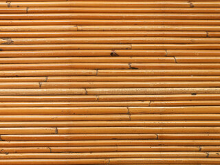 Surface texture of small blades of woven rattan, seamless textured woven rattan background
