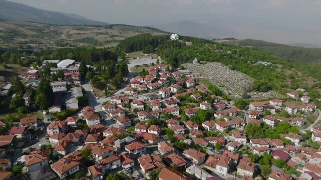 Ilinden Monument approaching from Krushevo, North Macedonia. Aerial view over Krusevo city in Macedonian Mountains,