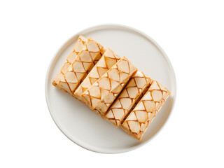 Italian crispy sweet bakery Sfogliatine glassate over white plate isolated. Tasty breakfast with apricot glaze puff pastries. Top view, cut out.