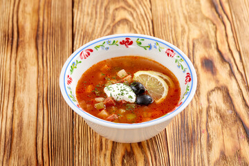 Soup with meat, vegetables, olives