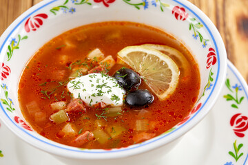 Soup with meat, vegetables, olives