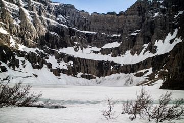 Iceberg lake at the Glacier national park, Montana, USA. Hiking trail is the most beautiful scenery of the u shape valley and covered with snow.