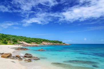 Picturesque tropical golden sandy Sunset Beach with turquoise water on Lizard Island, Australia. Lizard Island  is located on Great Barrier Reef in north-east part of Queensland