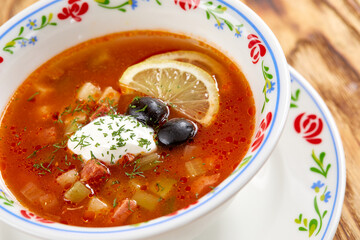 Soup with meat, vegetables, olives