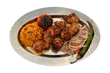 Top view traditional turkish meat and food service, Shish kebab on pita served with tomatoes, peppers and onions, with bulgur rice. isolated on white background.