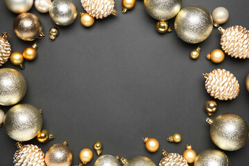 Frame of different shiny Christmas tree baubles on grey background, flat lay. Space for text