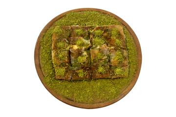 pistachio katmer presented on wooden plate. image of delicious and beautiful katmer. top view. white background.